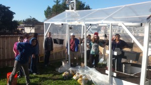 JCS students help move soil into new greenhouse